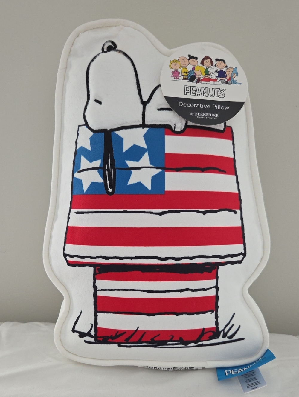 SNOOPY SNOOZING ON HIS PATRIOTIC DOGHOUSE PILLOW